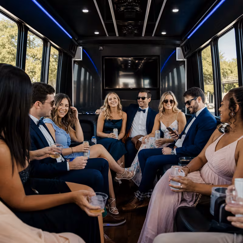 Wedding guests seated inside a Savannah party bus
