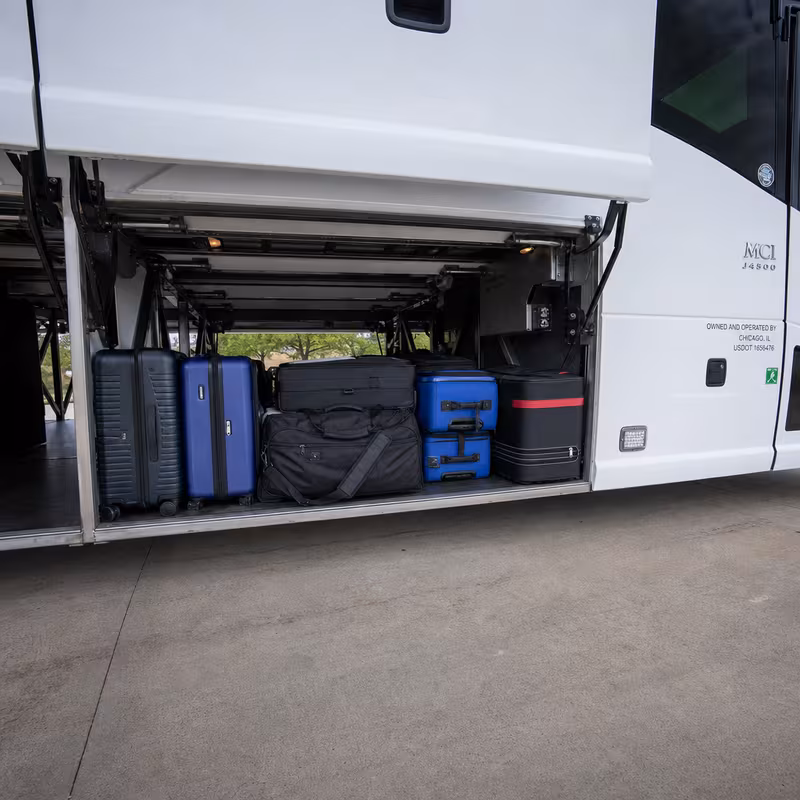 Party bus interior with wraparound leather seating and LED lighting in Savannah