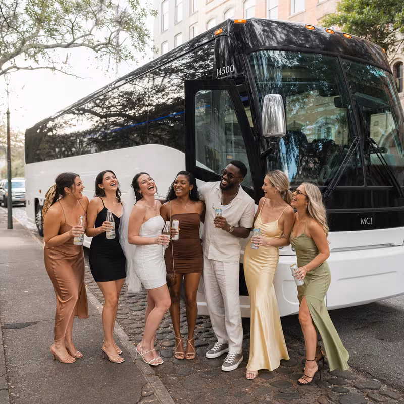 Passengers loading luggage while boarding an Savannah group shuttle