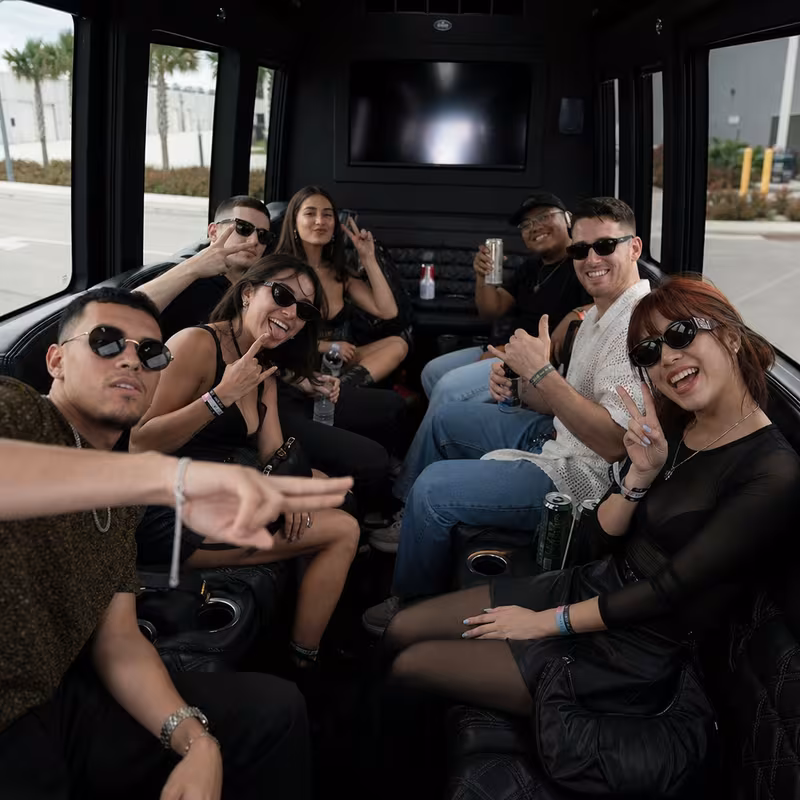 Group boarding a white charter bus for Concert Transportation transportation in Savannah